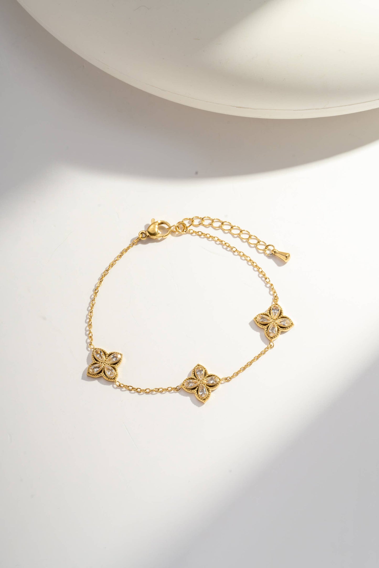 COSMOS Kleeblatt Schmuck-Set aus Stahl: Kette, Armband und Ohrringe in Gold